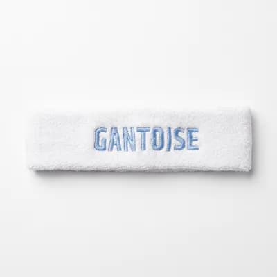 Gantoise Haarband — witte badstof hoofdband met geborduurd GANTOISE in hemelsblauw